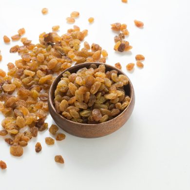 brown and white nuts on brown wooden bowl