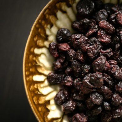 black berries on yellow ceramic plate